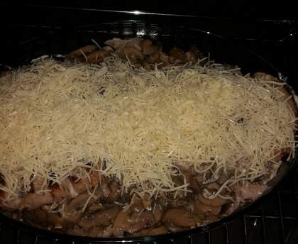 Rôti de porc aux champignons gratiné