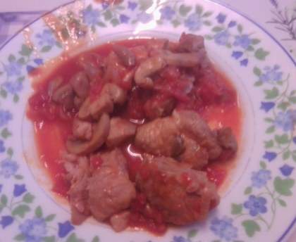 Sauté de porc au curry, tomates et champignons
